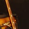 Combo amplifier for electric guitar with guitar neck on black background. Shallow depth of field, low key, close up. Focus on