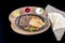 Combo Fajita; top down photo of mexican steak and chicken fajitas in iron skillet with corn tortillas