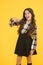 Come with me. Hey you. Manners of hothead. Girl long hair cool pointing forward. Child pointing camera yellow background