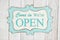 Come in we`re open text on a retro tin polka dot picture sign
