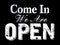 Come in we`re open, vintage black retro sign with the text in white color