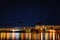 Comet Neowise over Rijeka port city on Adriatic sea, Croatia. Amazing night cityscape with city lights and blue starry sky