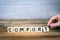 Comfort. Wooden letters on the office desk