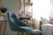 Comfortable blue chair in teenage girl`s bedroom interior. Idea for design