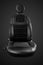 Comfortable driver car seat with round headrest isolated on black background