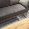 Comfortable gray sofa and wooden coffee table