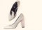 Comfortable high heels concept. Pair of fashionable high heeled shoes. Shoes made out of grey suede on white background