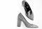 Comfortable high heels concept. Pair of fashionable high heeled shoes. Shoes made out of grey suede on white background