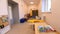 Comfortable playroom with toys and children furniture