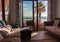Comfortable room with sofa and balcony with sea view.  Cozy interior of apartment. Living room with stylish decor and furniture.