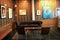Comfortable seating in room, with artwork hanging on walls, Old 77 Hotel and Chandlery, New Orleans, 2016
