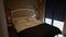 Comfortable soft bed in hotel room indoors with no people. Cozy furniture in wooden bedroom in summer house. Comfort and