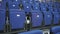 Comfortable soft empty blue seats in the arena of a sports facility. Rows of armchairs.