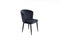 Comfortable velours black armchair on white background. Interior element