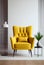 Comfortable yellow armchair against white wall background. Home interior concept