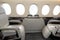 Comfortible cabin chairs in a modern business jet aircraft durin