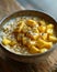 A comforting bowl of oatmeal with mango and poppy seeds