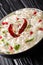 Comforting Curd Rice is a popular dish from South India with yogurt and then tempered with spices closeup in a plate. Vertical