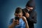 Comic masked man spying data from smartphone of teenager