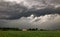 The coming of a big storm, tempest or hurricane over the countryside landscape.