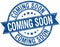 coming soon grunge retro blue ribbon stamp