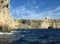 COMINO, MALTA - Apr 27, 2014: View of Santa Marija Tower, standing guard over the cliffs and blue sea of the island of Comino