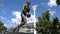 Commemorative statue of Jim Stynes Melbourne Demons legend running with the footy at Melbourne Cricket Ground precinct