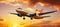 Commercial airliner flying above dramatic sunset cloudsTravel and transportation concept.