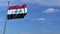 Commercial airplane landing behind waving Iraqi flag. Travel to Iraq conceptual animation