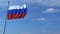 Commercial airplane landing behind waving Russian flag