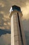 Commercial Airport Control Tower Photo Illustration From Close Up Perspective with large storm developing overhead