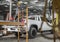 Commercial Building Construction Worker Staying on His Pickup Truck Cargo Bed