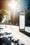 Commercial Cityscape - Vertical White Billboard on Bus Stop on a Sunny Summer Day - Model in Urban Setting...Vertical White Poster