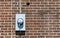 Commercial Electric Meter On Old Brick Wall With Copy Space