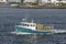 Commercial fishing boat Voyager leaving Fairhaven with load of lobster traps