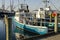 Commercial fishing boat Voyager reflected in skim of ice near docks