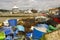 Commercial fishing nets and plastic boxes discarded on the quayside at Warsash on the south coast pf England in Hampshire