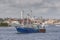 Commercial fishing vessel Blue South passing Palmer Island Light Station in New Bedford harbor