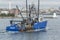 Commercial fishing vessel Guidance passing lighthouse