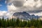 Commercial Helicopter flying with rocky mountains in Assiniboine provincial park