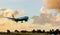 Commercial Jet plane about to land around Sunset in Barbados