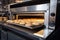 a commercial oven with a heated stone baking tray, ready to bake artisan bread