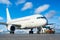 Commercial passenger airplane during push back operation.