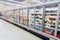 Commercial refrigerators in a large supermarket blurred background