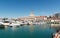 Commercial sea port of Sochi, Russia. Yachts and ships on Black Sea. Sochi, Russia - March 30, 2019