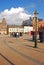 Commercial shops, restaurants & old historical buildings & pots of flowers in town centre of Big Square Stortorget, Malmo, Sweden