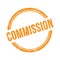 COMMISSION text written on orange grungy round stamp