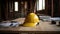 A commitment to safety, Yellow helmet on construction project desk