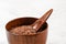 Common flax linseed - Linum usitatissimum - in small wooden cup bowl with little spoon