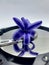 Common hyacinth single flower with reflections on silver hard disk plate closeup